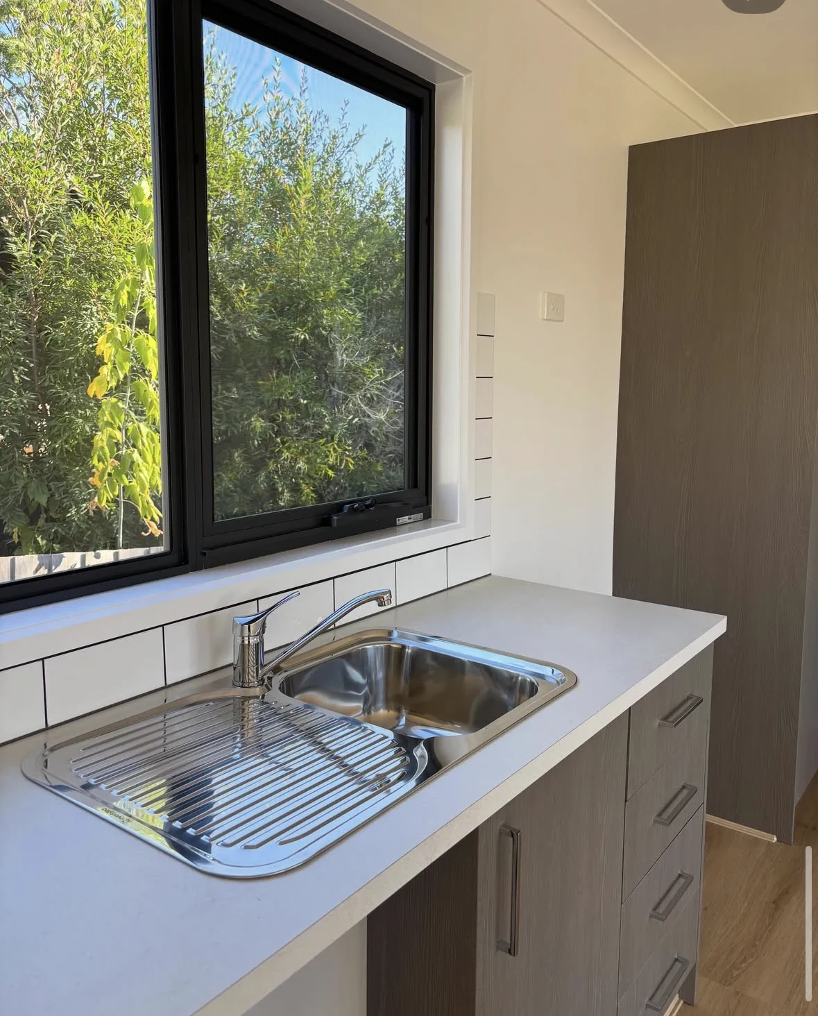 Kitchen sink and tap installed in a residential home